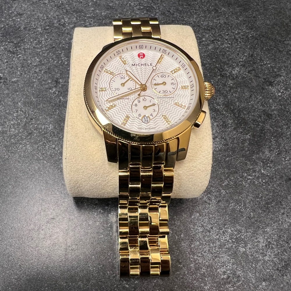 All gold round face Michele watch